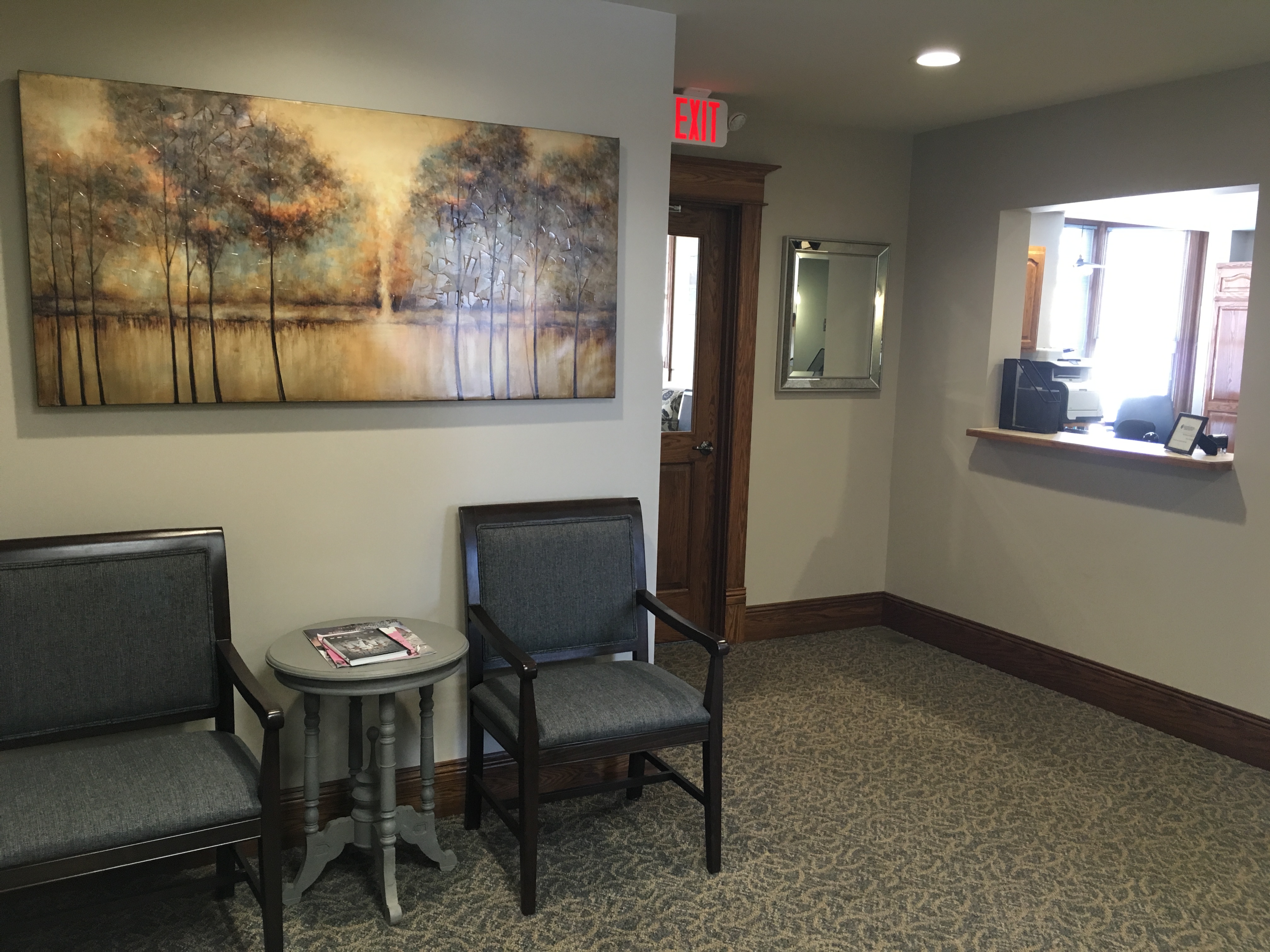 This is a sitting area for patients waiting to checkout. We made sure to include a mirror again so you can check out your smile before you go!